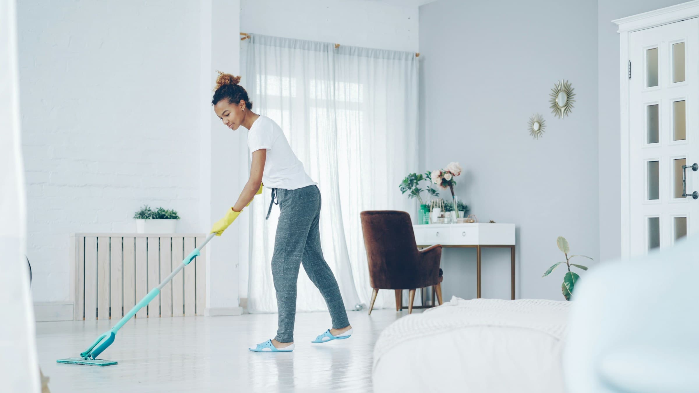 Mop and bucket on a clean wood floor.
